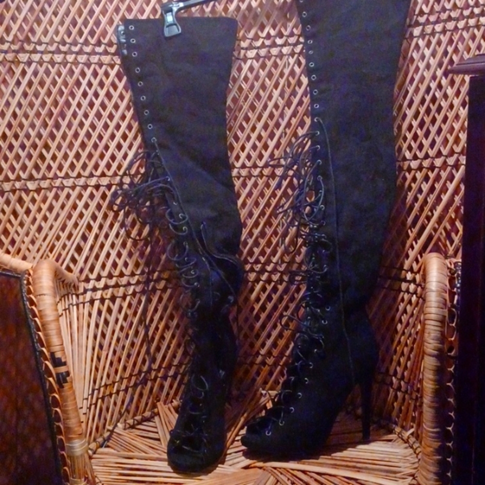 Thigh high lace up boots